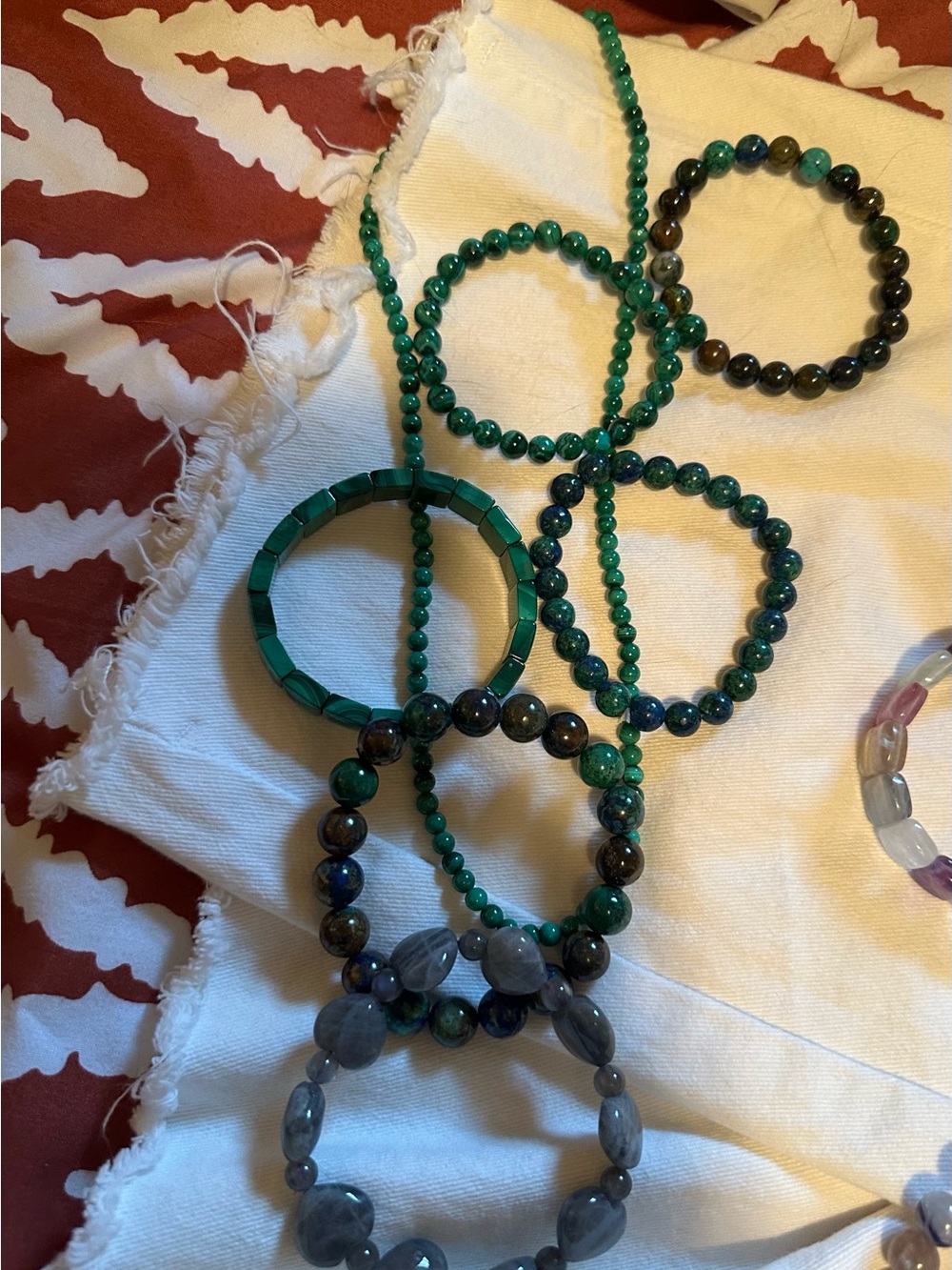 Malachite.  Lab and other gem bracelets.